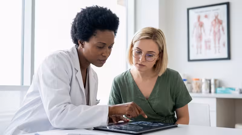 Doctor and patient consultation for Payment Options, Quotes and Clear Costs Up Front - Hearing First Surbiton – Insurance An...