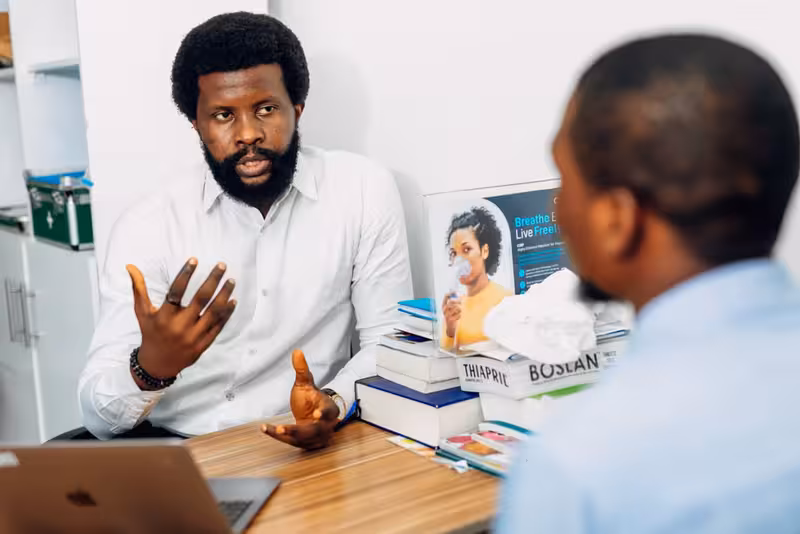 Doctor in clinic for Billing Support for Families, Repeat Visits and Ongoing Ear Care - Hearing First Surbiton – Insurance A...